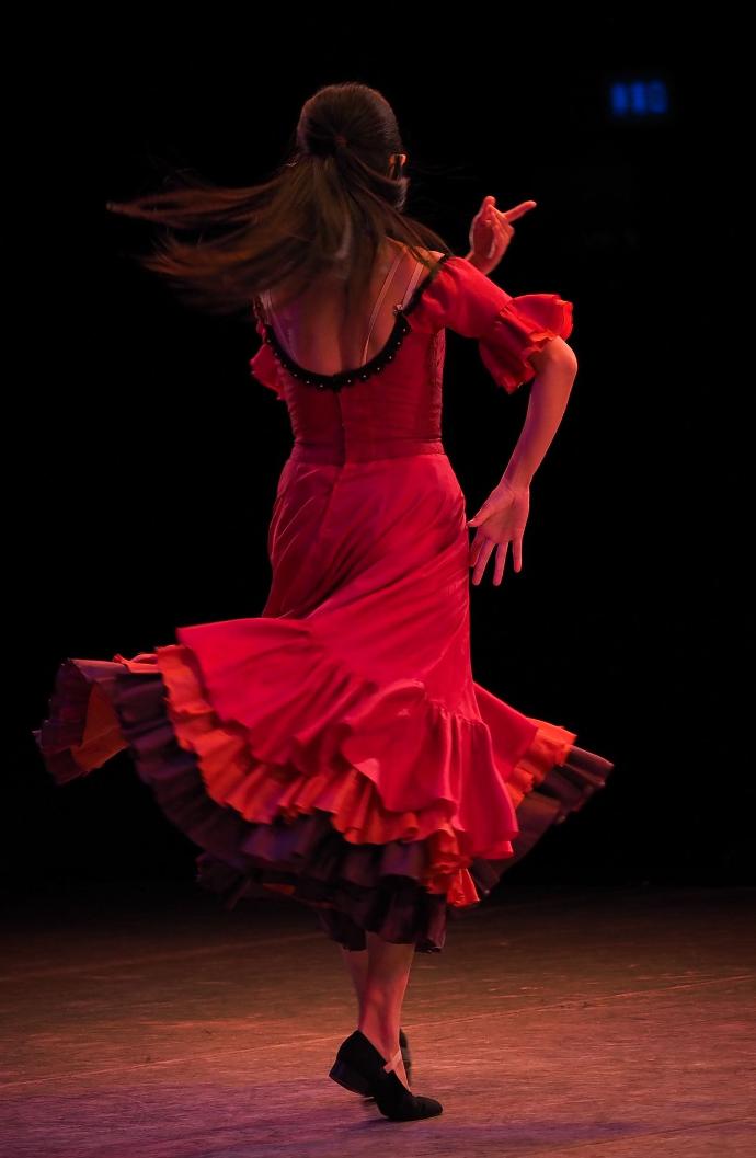 woman in red dress holding red heart